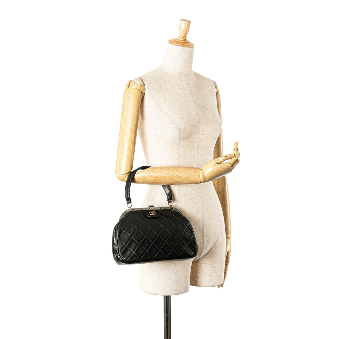 CC Quilted Lambskin Kiss Lock Frame Top Handle Bag Black - Gaby Paris