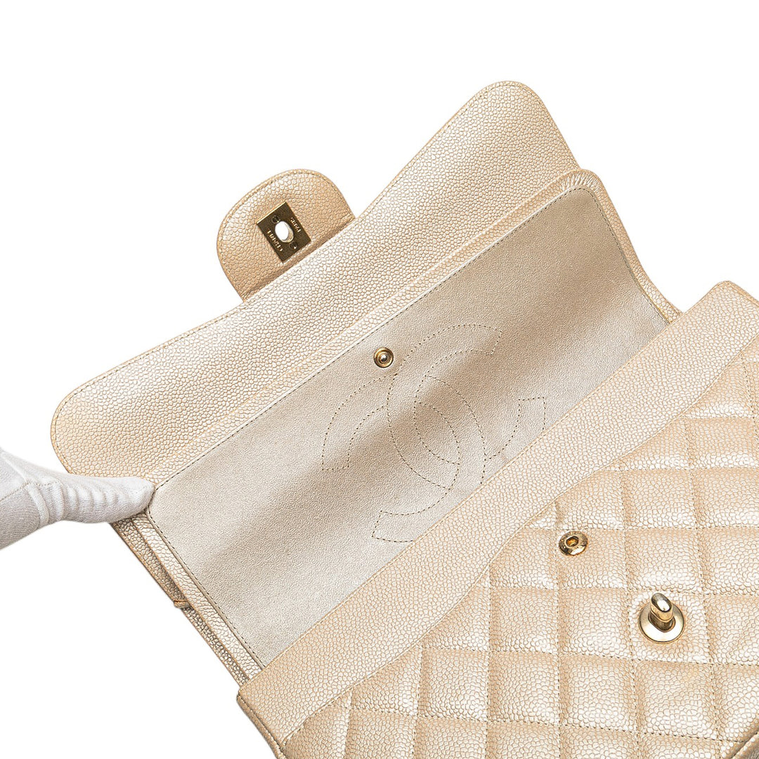 Jumbo Classic Iridescent Caviar Double Flap Gold - Gaby Paris