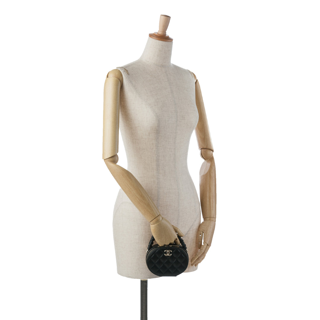 CC Lambskin Ruched Oval Top Handle Bag Black - Gaby Paris