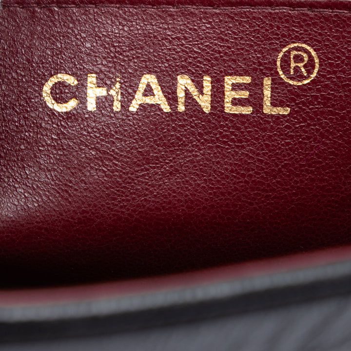 Chanel CC Vertical Quilt Cuir d’agneau à rabat