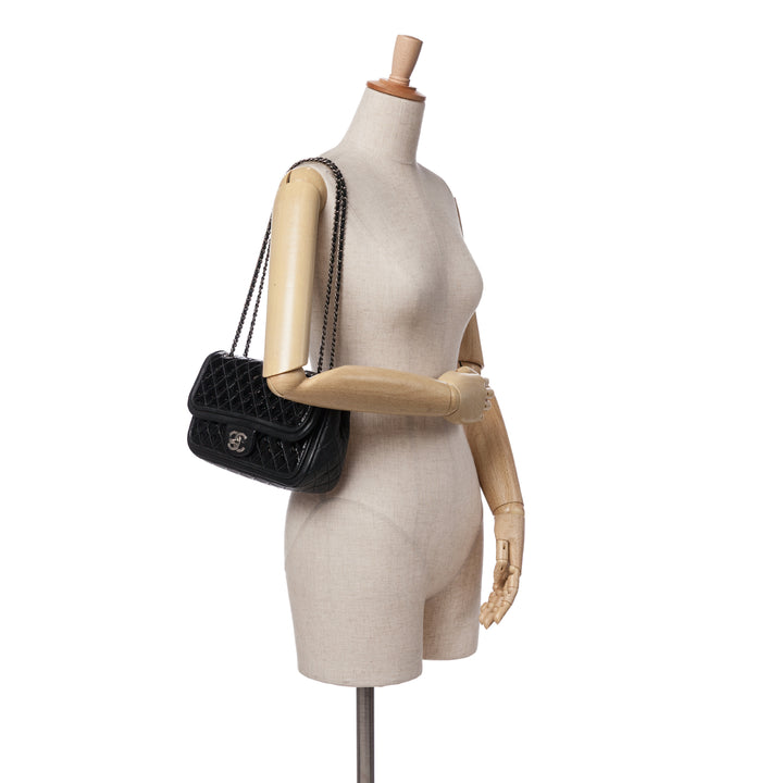 Medium Quilted Patent and Lambskin Classic Twist Flap Black - Gaby Paris