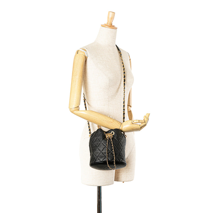 Quilted Lambskin Pearl Crown Drawstring Bucket Bag Black - Gaby Paris