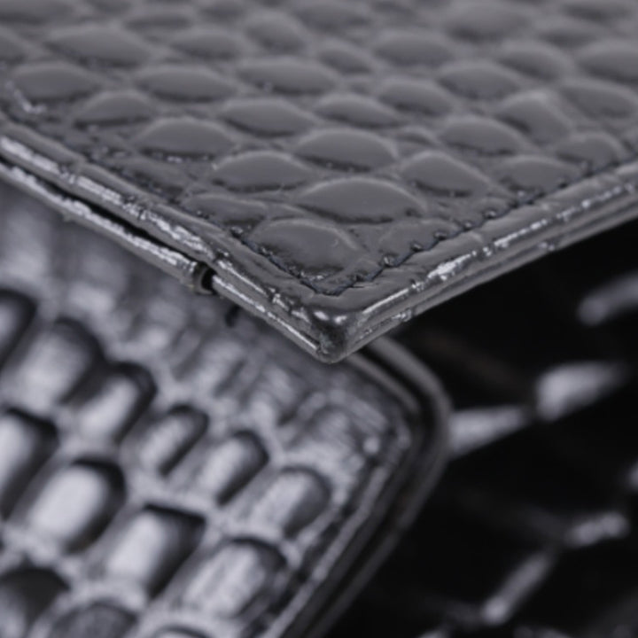 Saint Laurent Croc embossé Cuir verni Pochette