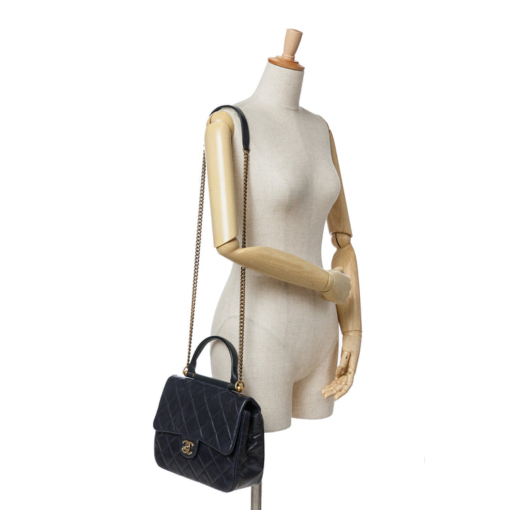Medium Quilted Glazed Calfskin Gold Bar Top Handle Flap Blue - Gaby Paris