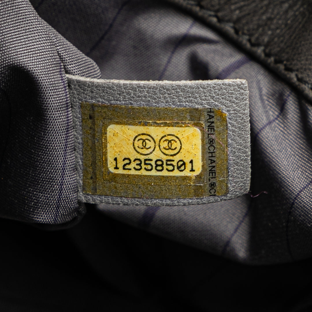 Chanel Cuir d’agneau clouté CC Accordion à rabat