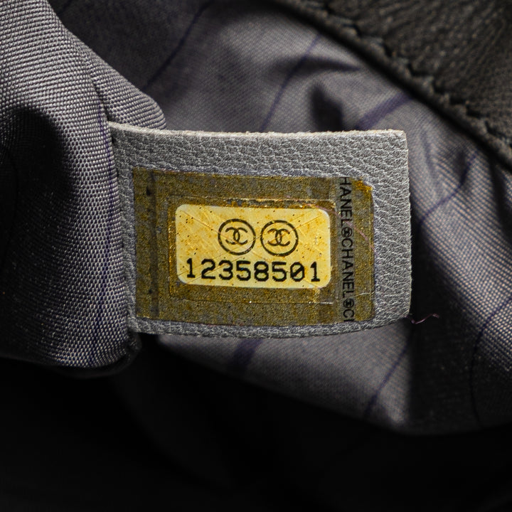 Chanel Cuir d’agneau clouté CC Accordion à rabat