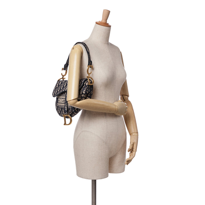 Oblique Embroidered Canvas Saddle Bag Blue - Gaby Paris