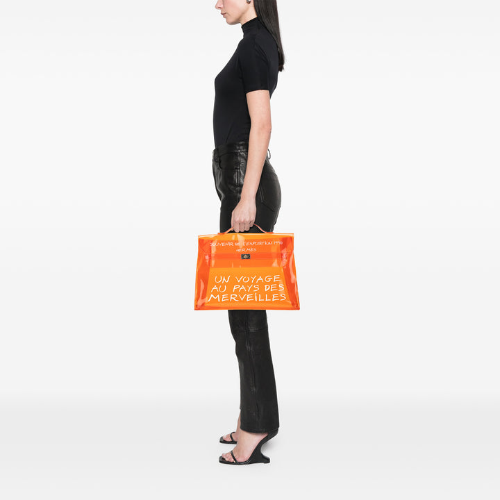 Vinyl Souvenir De L Exposition Kelly Handbag Orange - Gaby Paris