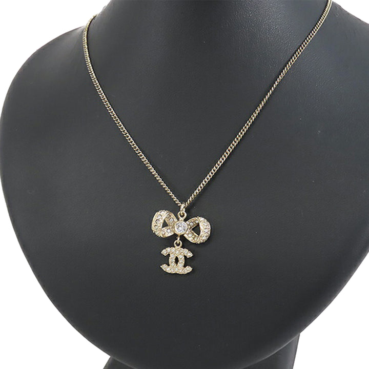 Gold Plated CC Bow Crystal Pendant Necklace Gold - Gaby Paris