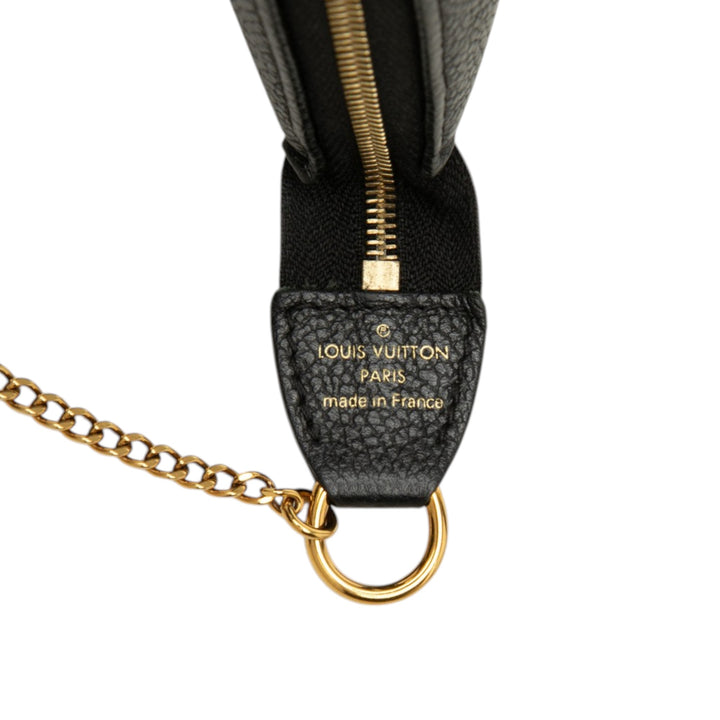 Louis Vuitton Bicolore Pochette Accessoires Mini Monogram Empreinte Noir – vue 5 – GABY PARIS