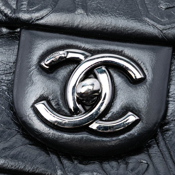 Chanel Medium embossé Cuir de veau Precious Symbols à rabat