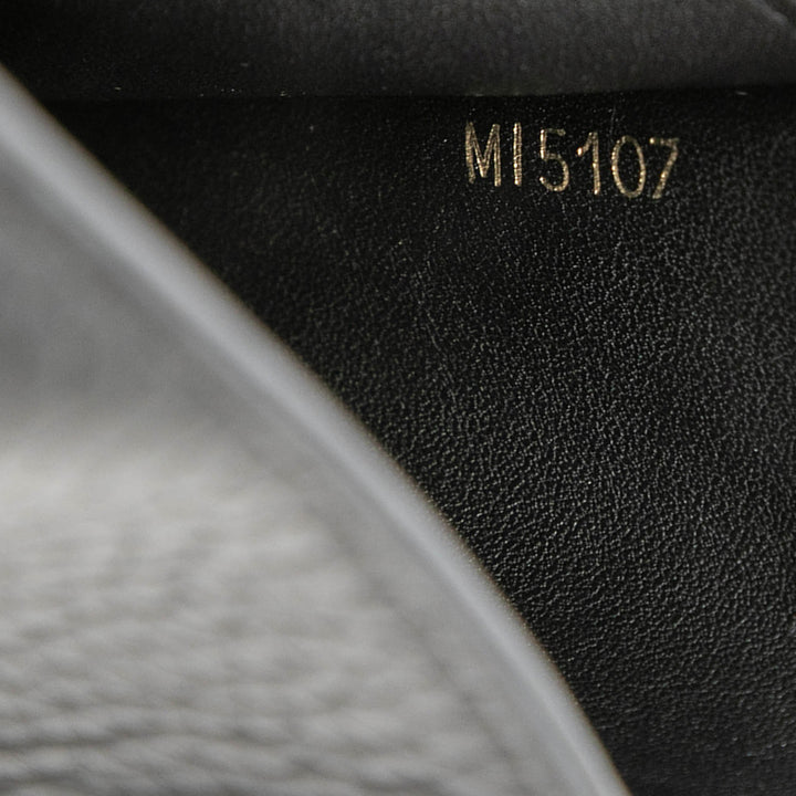 Louis Vuitton clouté Taurillon Capucines Compact Portefeuille