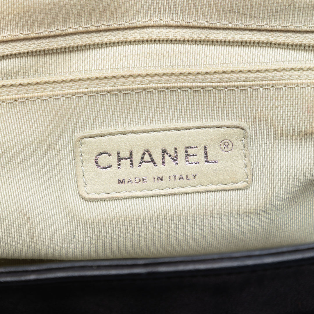Chanel CC Matelassé Cuir d’agneau Sac rond à chaîne à rabat