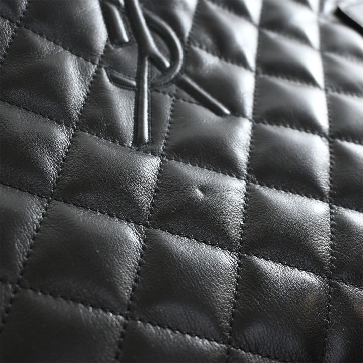 Saint Laurent Matelassé Cuir de veau Monogram ES Giant Sac de voyage