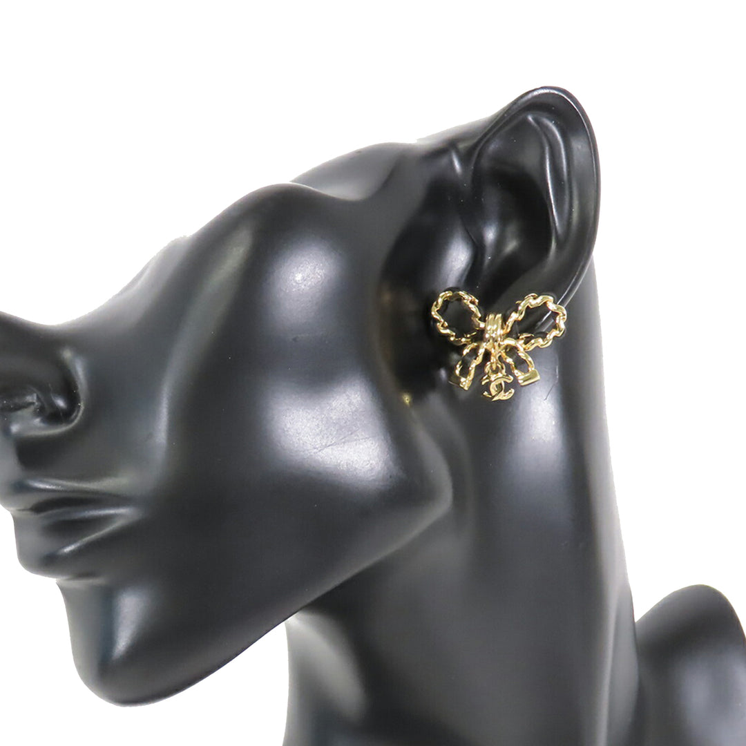 Chanel CC Cuir Woven plaqué Bow Boucles d’oreilles