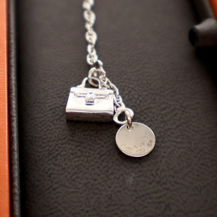 Hermès Sterling Argenté Amulettes Kelly Bracelet Argenté