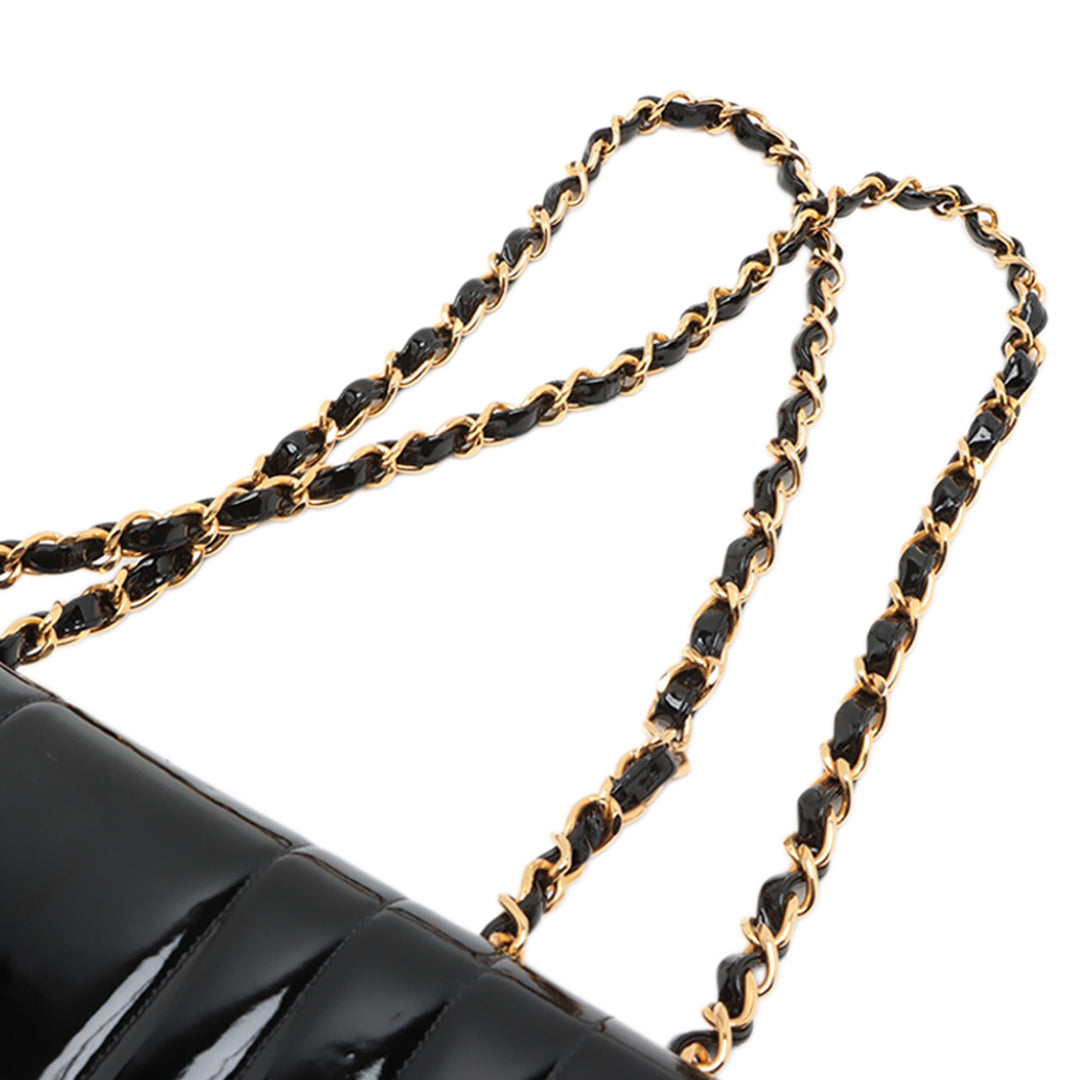 Chanel Jumbo Cuir verni Vertical Quilt Mademoiselle Flap Noir – GABY PARIS Authentique