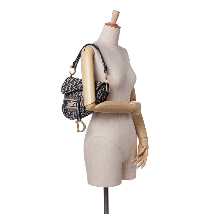 Oblique Embroidered Canvas Saddle Bag Blue - Gaby Paris