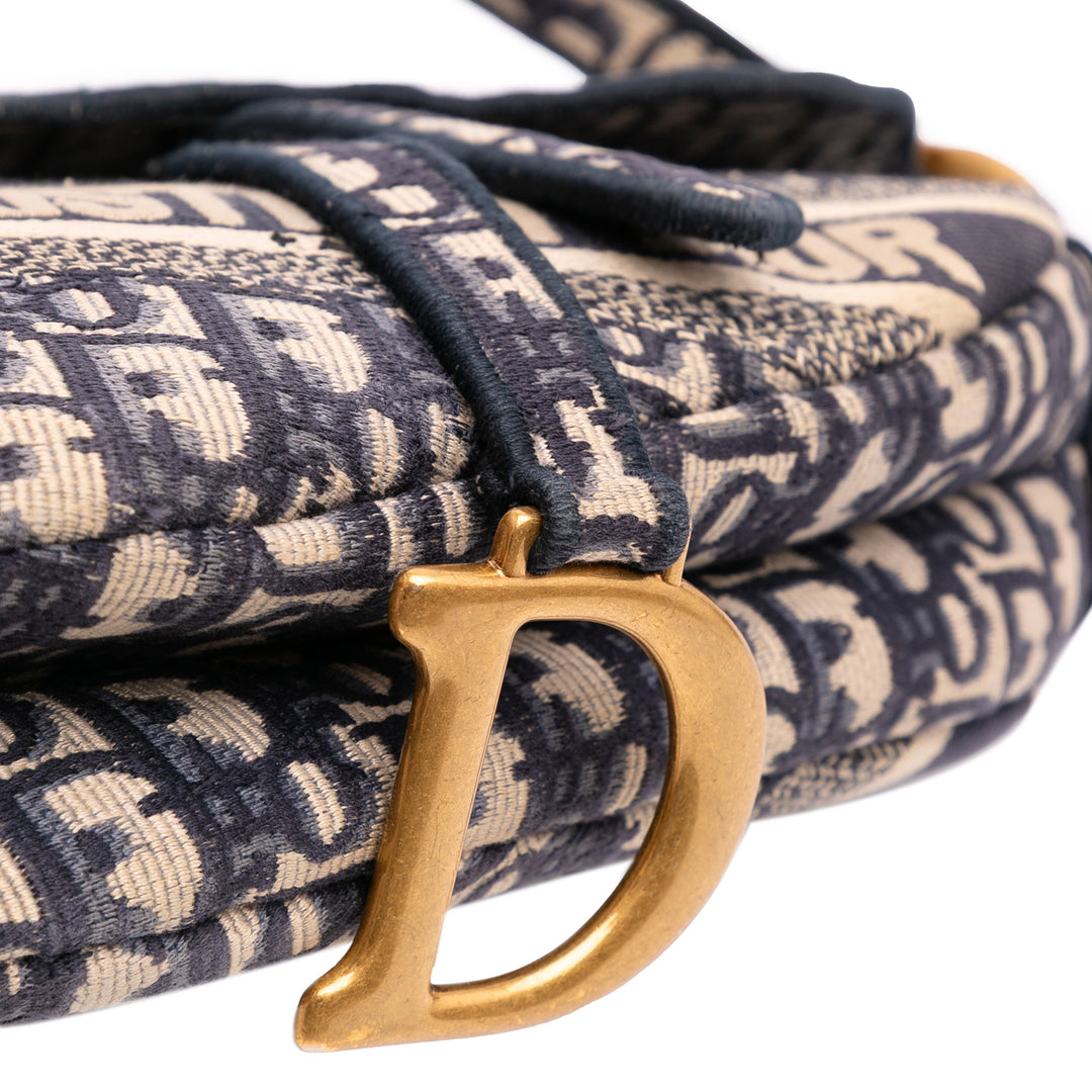 Oblique Embroidered Canvas Saddle Bag Blue - Gaby Paris