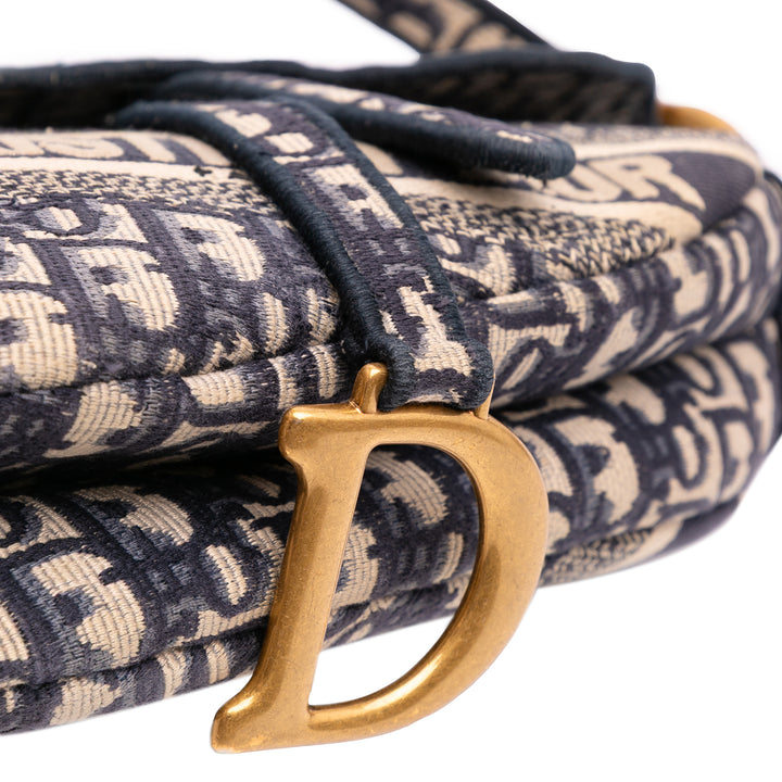 Oblique Embroidered Canvas Saddle Bag Blue - Gaby Paris