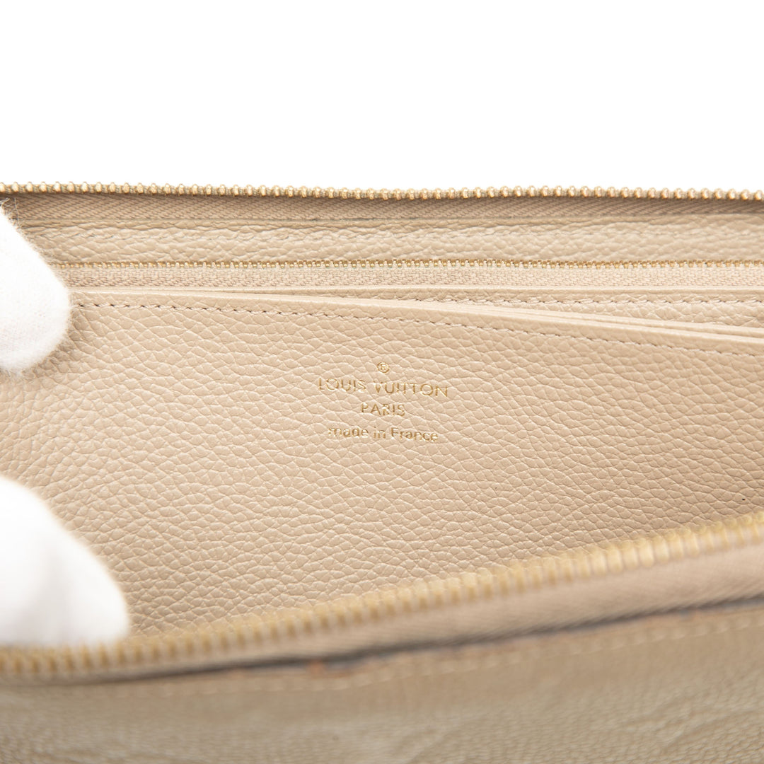 Zippy Portefeuille long Monogram Empreinte Beige