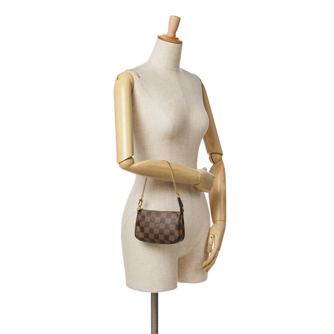 Damier Ebene Mini Pochette Accessoires Brown - Gaby Paris