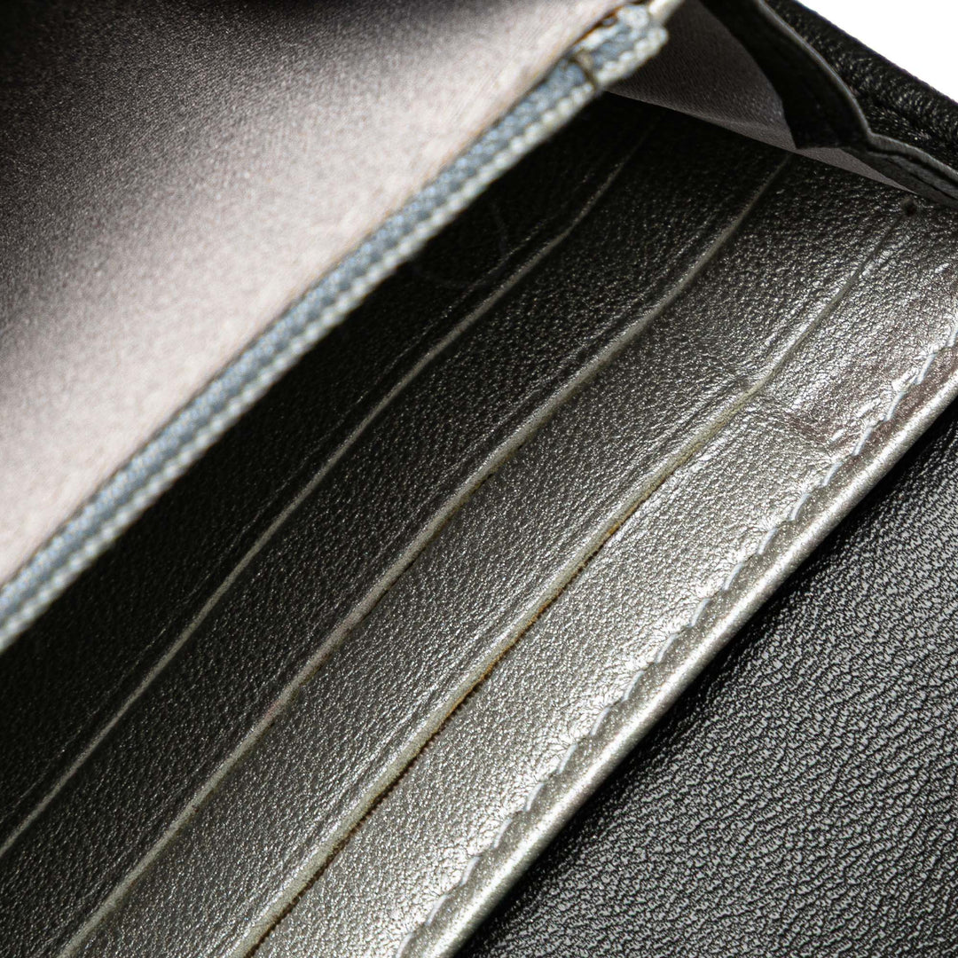 CC Embossed Calfskin Camellia Flap Wallet Black - Gaby Paris