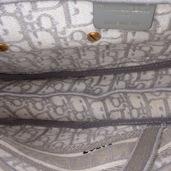 Oblique Embroidered Canvas Saddle Bag Gray - Gaby Paris