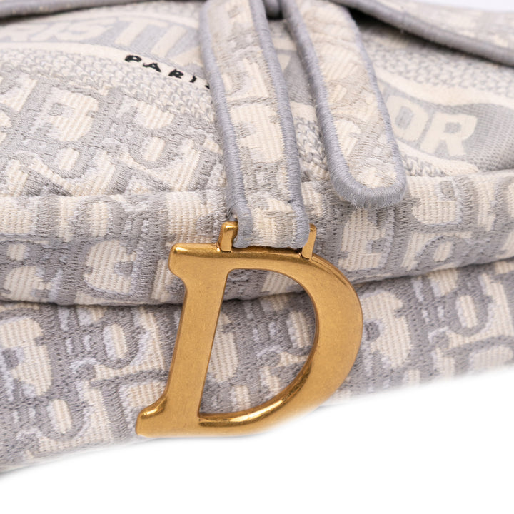 Oblique Embroidered Canvas Saddle Bag Gray - Gaby Paris
