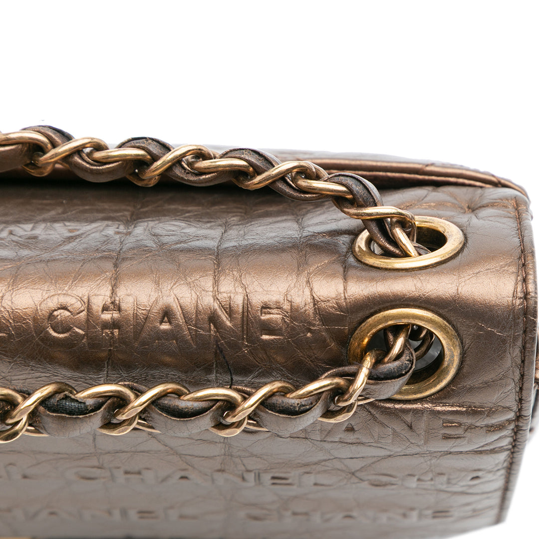 Chanel Paris Dallas Métallisé Cuir de veau Embossed Logo Flap Marron – GABY PARIS Authentique