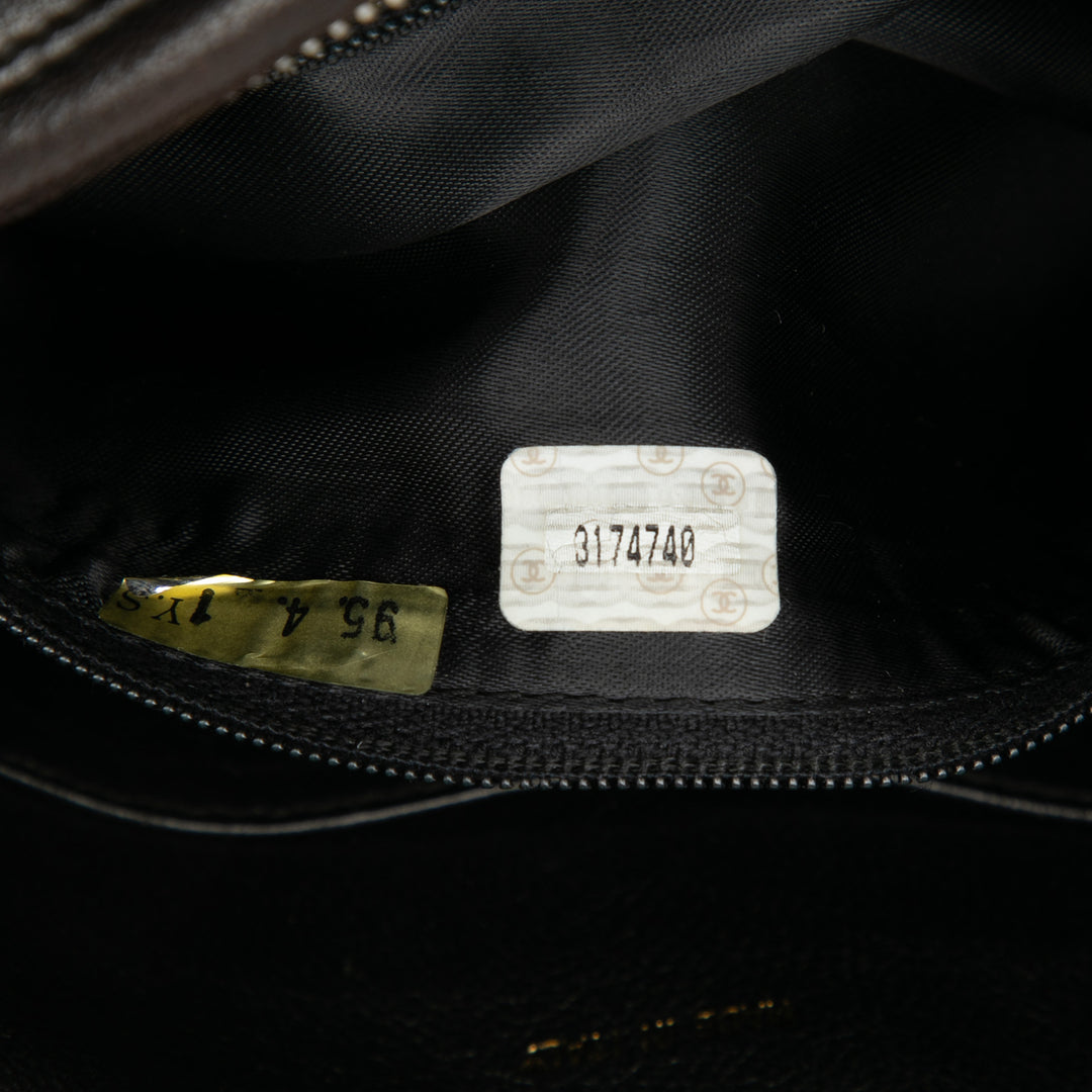 Chanel CC Stitched Cuir d’agneau Tassel à rabat Sac porté croisé