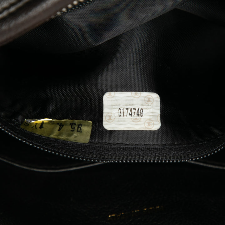 Chanel CC Stitched Cuir d’agneau Tassel à rabat Sac porté croisé