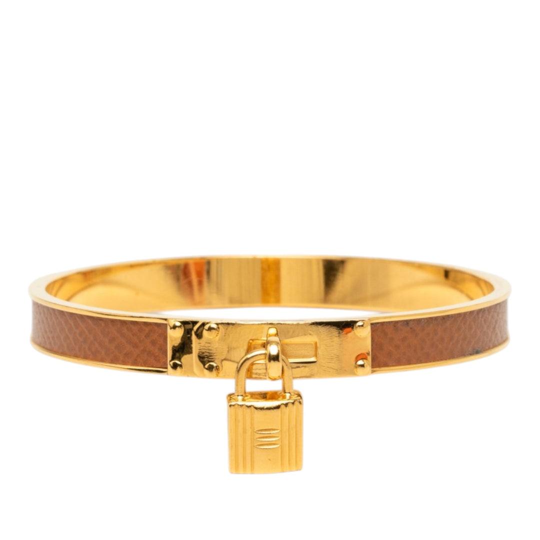 Hermès plaqué Kelly Cadena Lock Bangle Bracelet Epsom Doré – vue principale – GABY PARIS