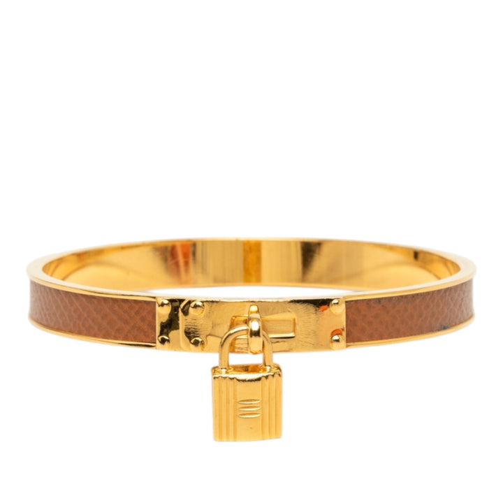 Hermès plaqué Kelly Cadena Lock Bangle Bracelet Epsom Doré – vue principale – GABY PARIS