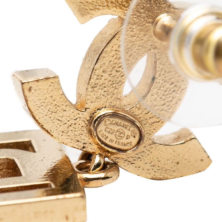 Chanel CC Brass Strass Boy Swing fermoir poussette Boucles d'oreilles Métal