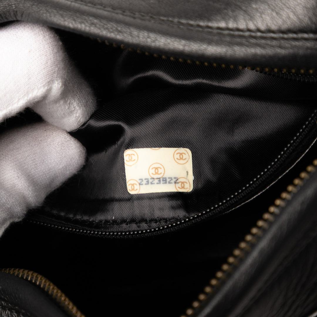 Chanel CC Quilted Cuir d’agneau Tassel Sac caméra Noir – GABY PARIS Authentique