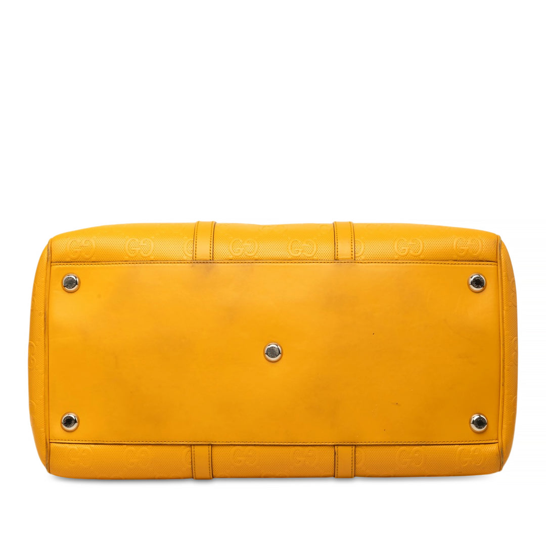 Gucci Sac de voyage GG embossé Duffle Cuir de veau Jaune – vue 3 – GABY PARIS