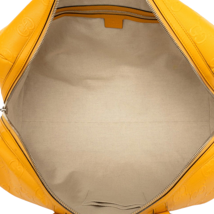 Gucci Sac de voyage GG embossé Duffle Cuir de veau Jaune – vue 4 – GABY PARIS