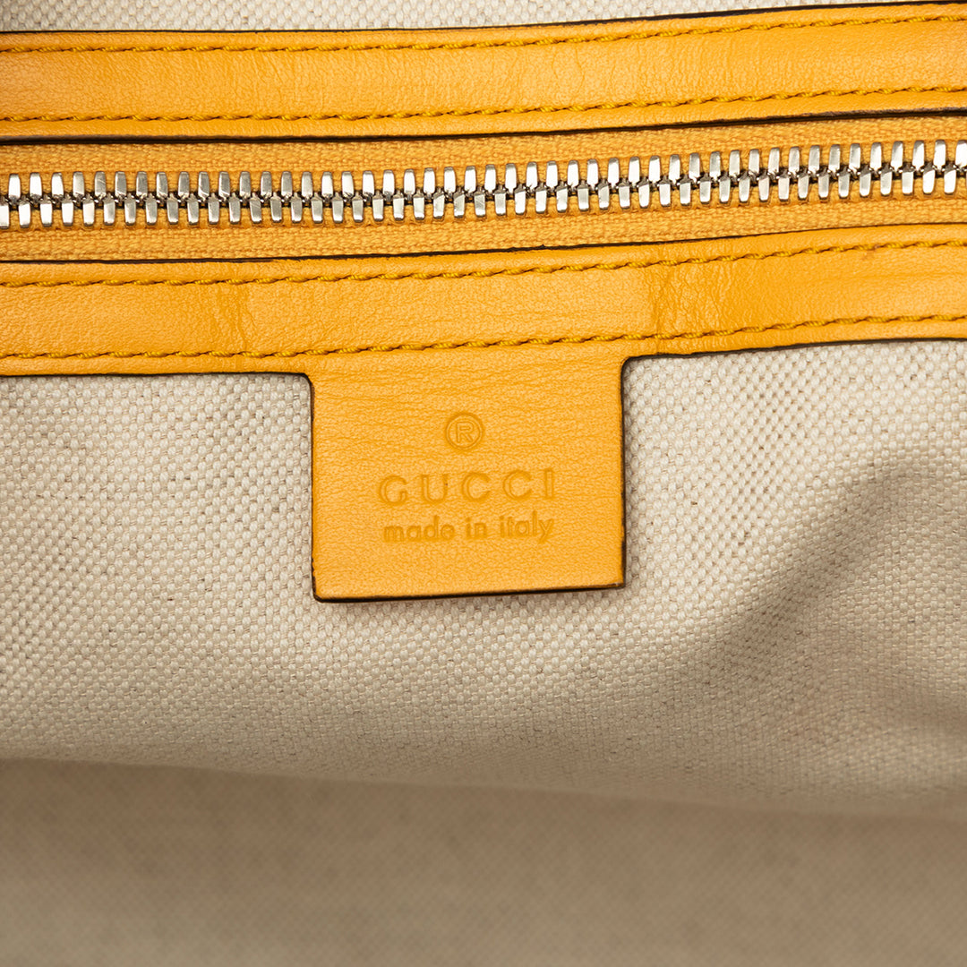 Gucci Sac de voyage GG embossé Duffle Cuir de veau Jaune – vue 5 – GABY PARIS