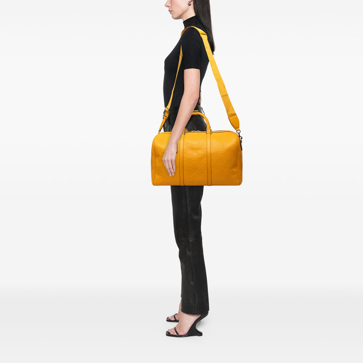 Gucci Sac de voyage GG embossé Duffle Cuir de veau Jaune – vue 6 – GABY PARIS