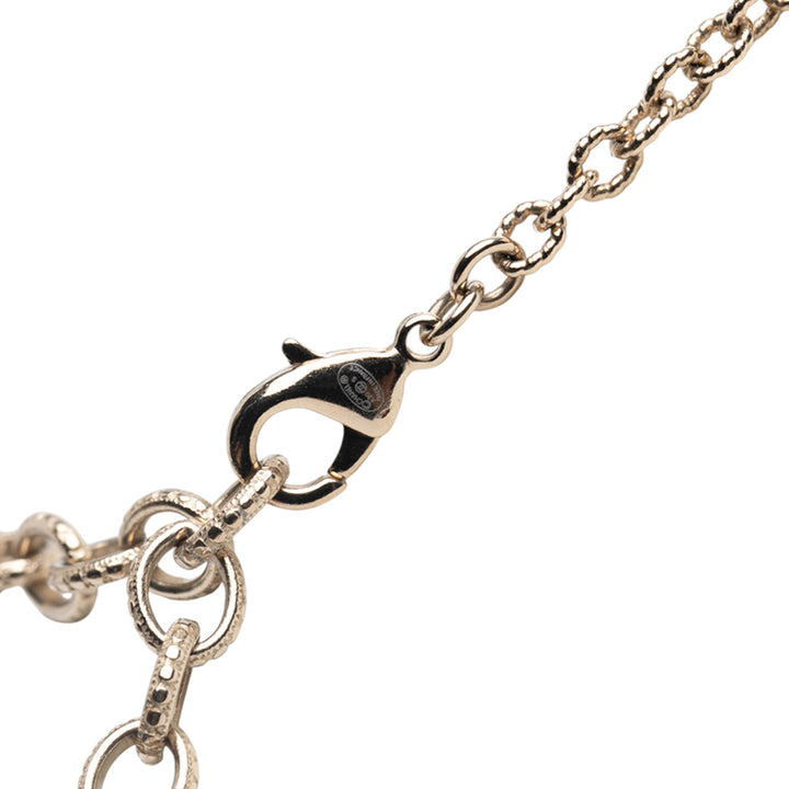 Chanel Doré Plated CC Rhinestones and Faux Pearl Sun Moon Cat Pendant Collier Doré – GABY PARIS Authentique