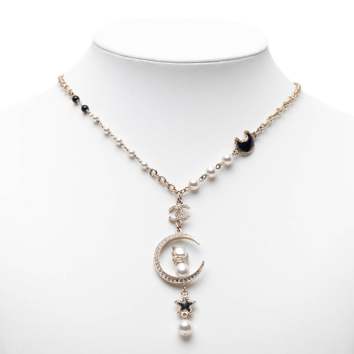 Chanel Doré Plated CC Rhinestones and Faux Pearl Sun Moon Cat Pendant Collier Doré – GABY PARIS Authentique