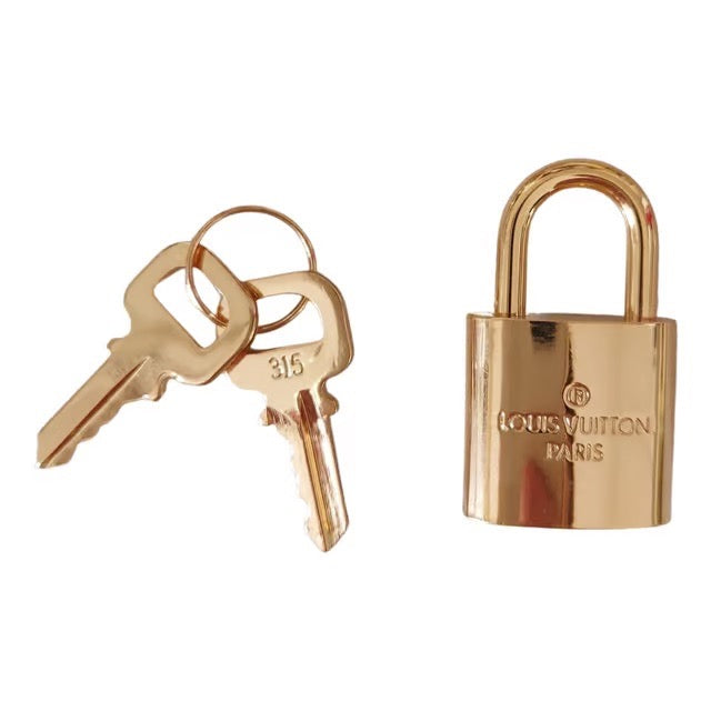 LOUIS VUITTON padlock in golden brass